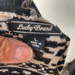 Large black and tanish cardigan no pockets size L small hole by collar